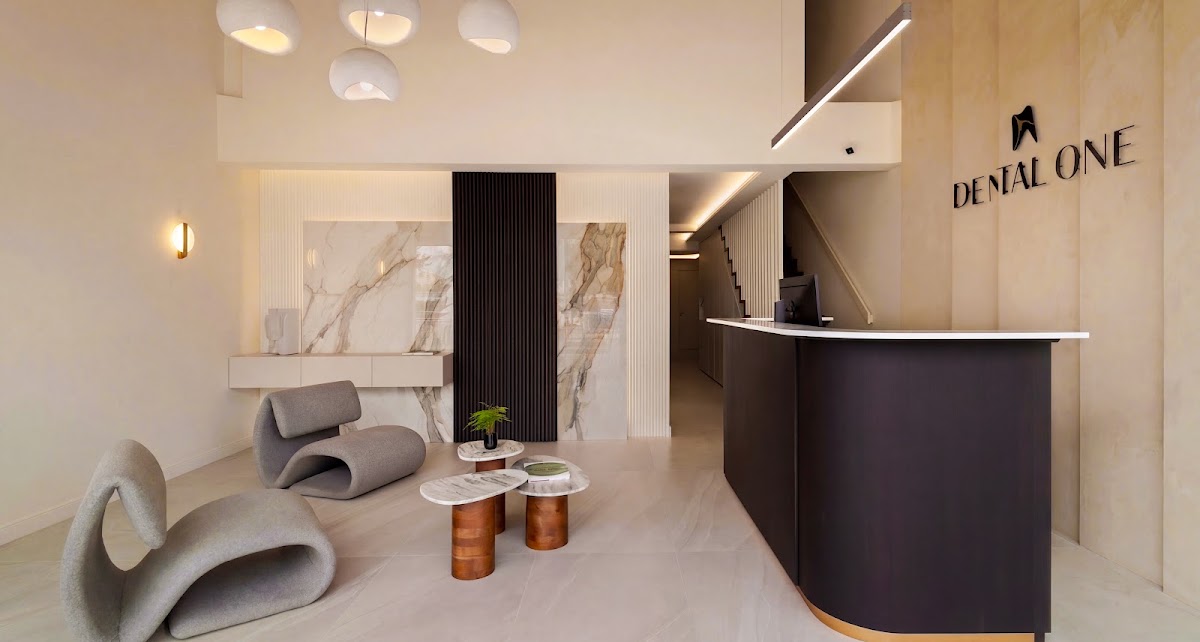 The welcoming marble reception and seating at Dental One Clinic