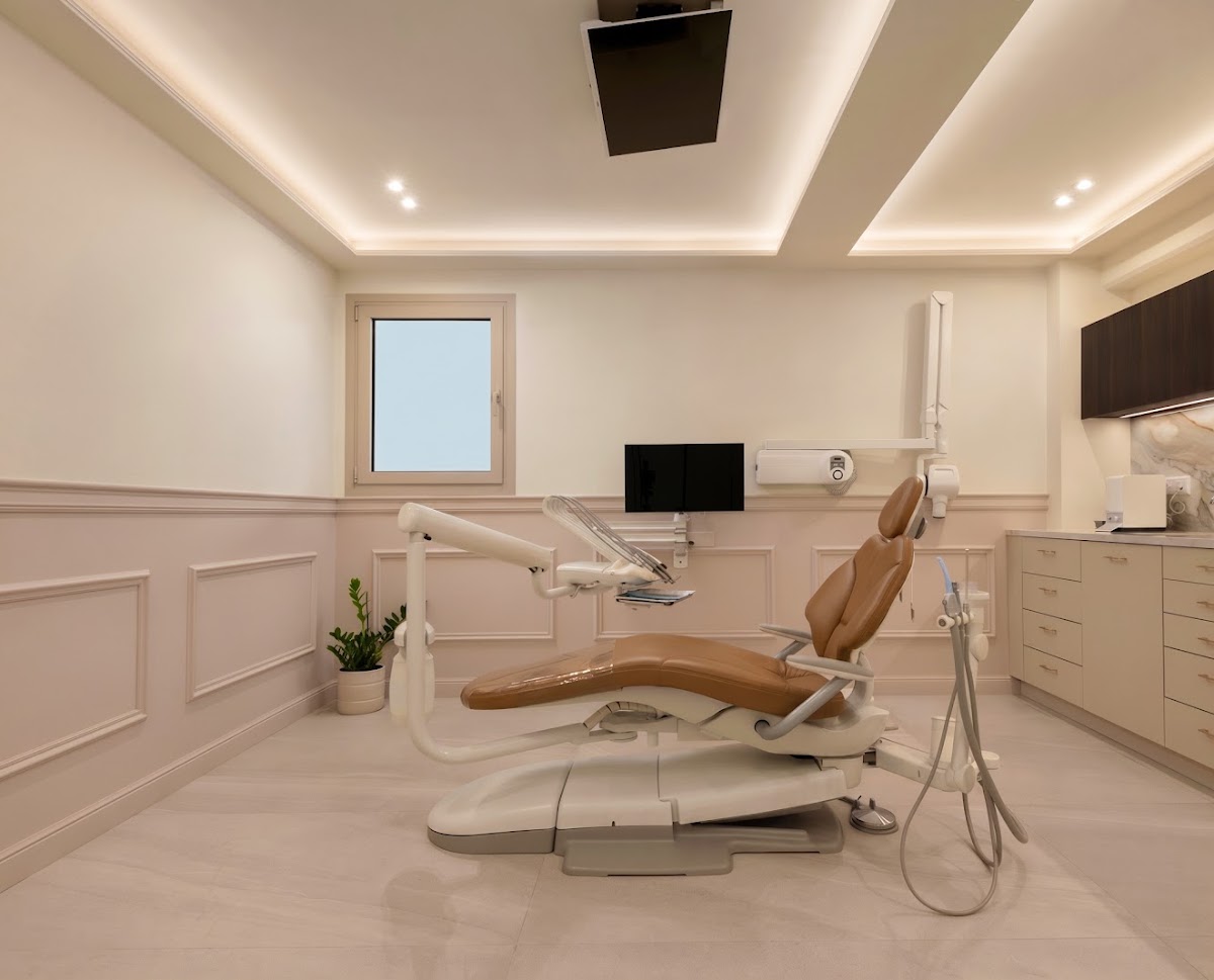 Dental One treatment room with cream interiors and a tan dental chair